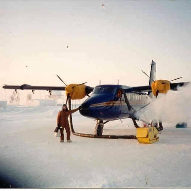 The author standing next to a twin otter aircraft at -40 degrees in Northern Alaska
