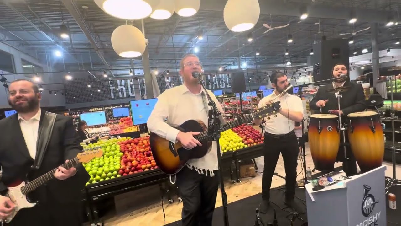 Moishy Glick on keys Evergreen Grand Open