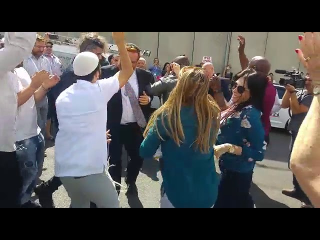 MK Glick dances with members of visiting Christian delegation at Kever Rochel