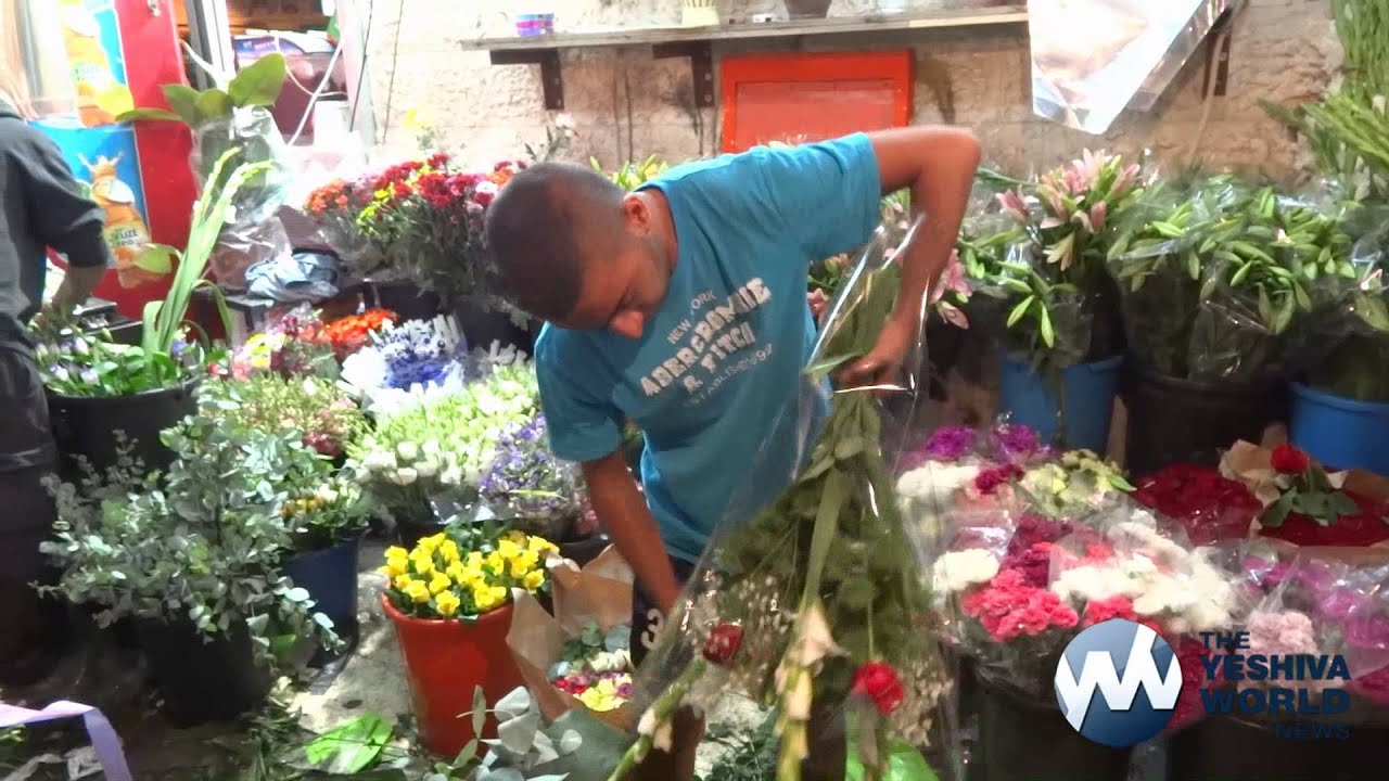 People Buying Flowers for Shavous