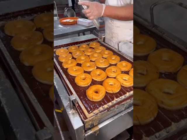 How Chocolate covered Donuts with sprinkles are made.