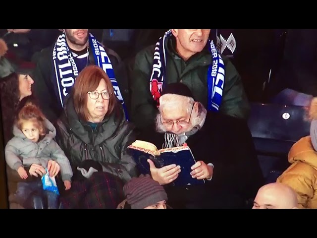Rabbi caught learning during Soccer Game
