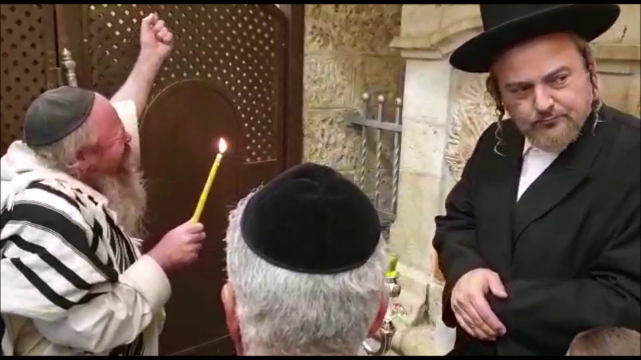 Mekubal Rav Addas Lighting Menorah At Kever Rochel