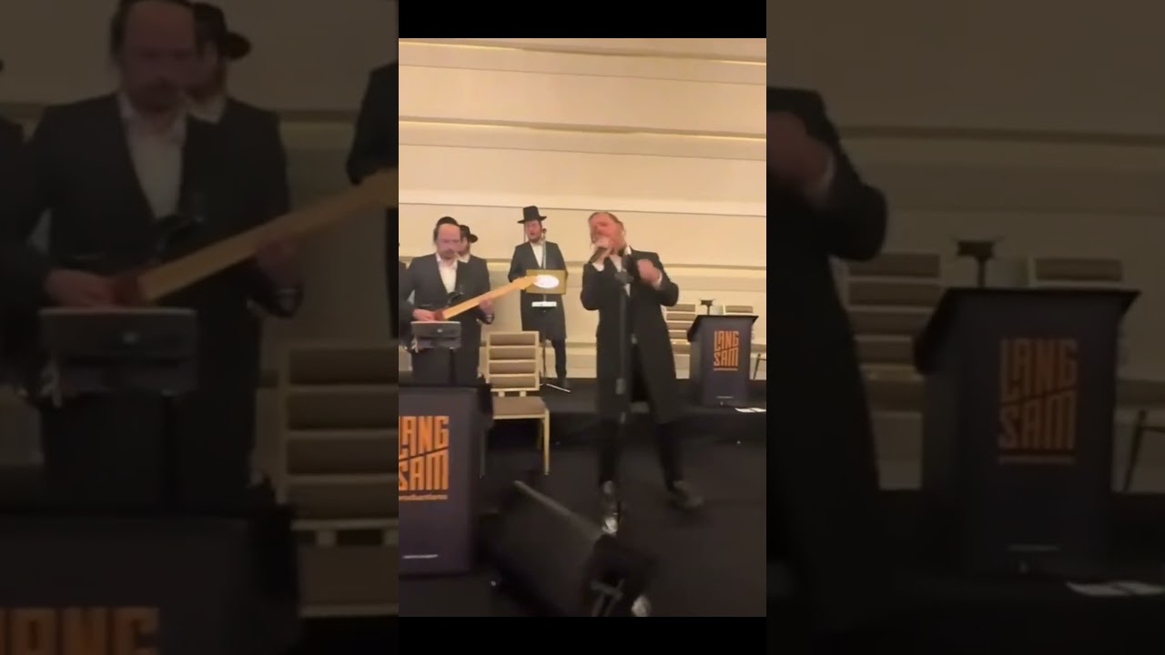 Men in Black Suits Deliver a Captivating Indoor Performance