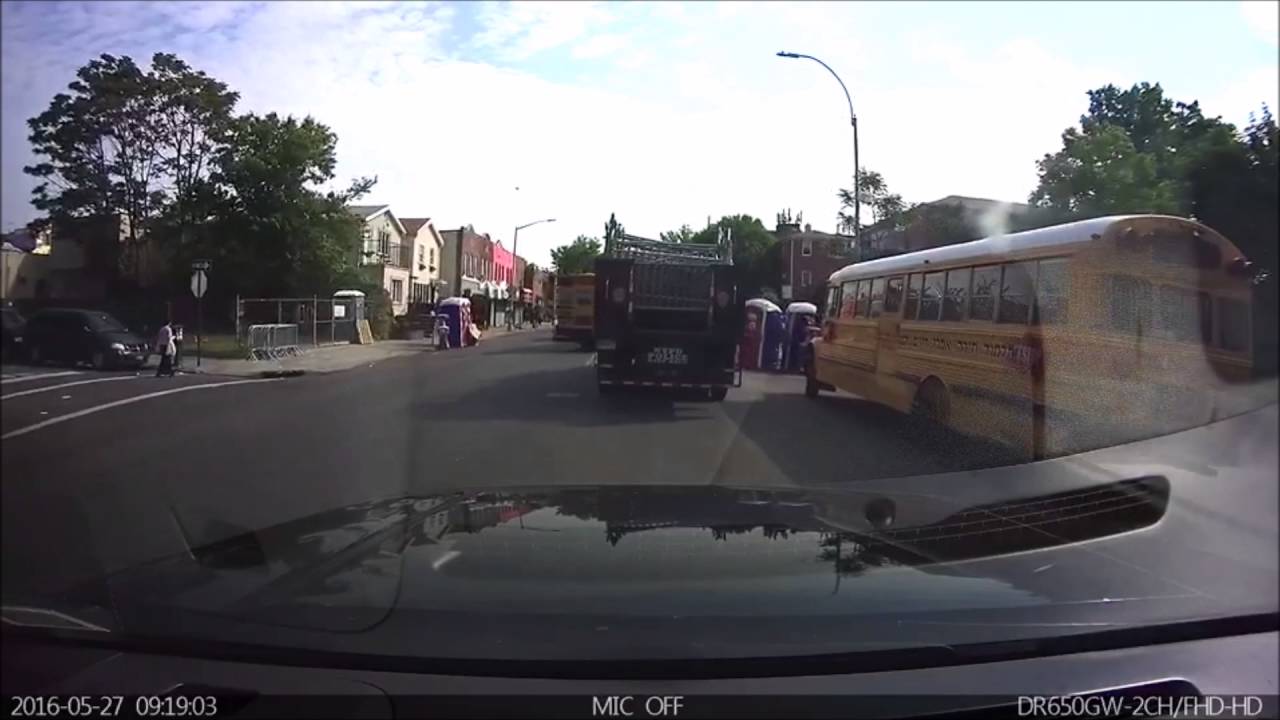 NYPD Truck Passes School Bus  In Brooklyn With Flashing Lights