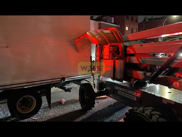 A truck lost control at Bedford Ave & Ross St, striking a parked cherry picker