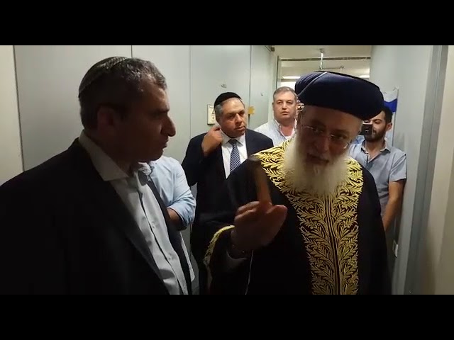 Affixing a mezuzah at Elkin campaign HQ