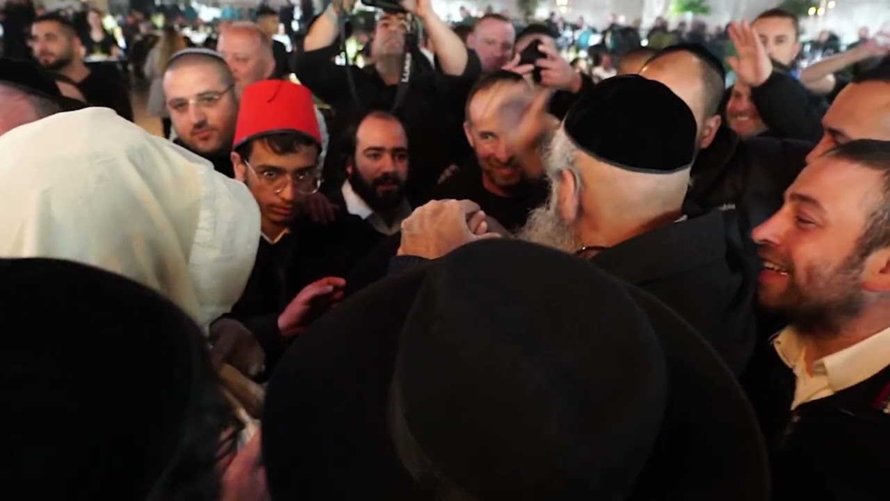 The Yanuka as Sandak at the bris of a talmid with Hagaon R’ Dov Kook the mohel