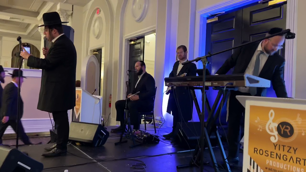 Yitzy Rosengarten at a wedding in Lakewood with Kalmy Shwartz