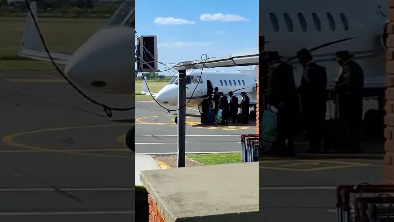 Satmar Rebbe R’ Aaron Enters The Airplane On His Way To Argentina
