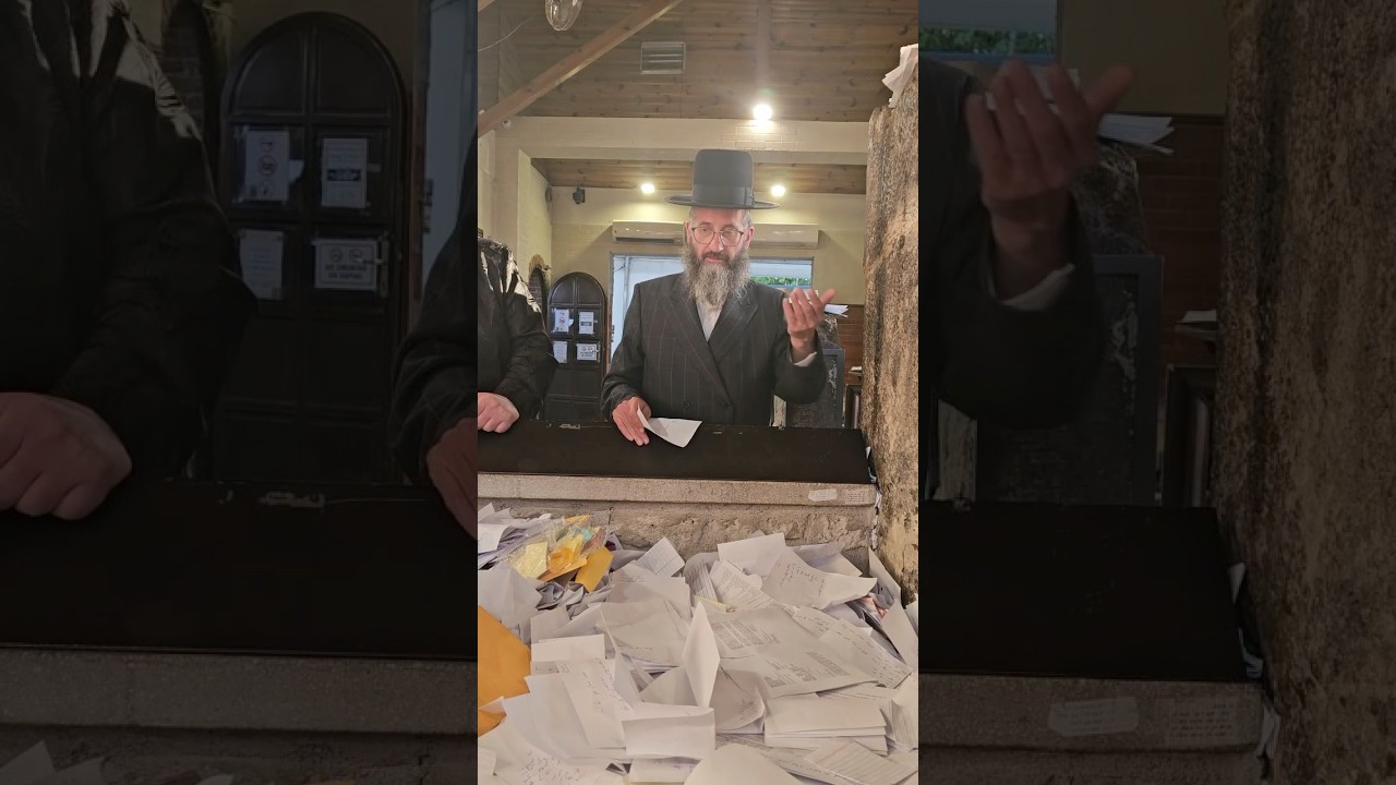 Moshe Yosef Freidlender of Reb Shayale’s Guest House praying at the Tziyun of Reb Shayale Kerestirer