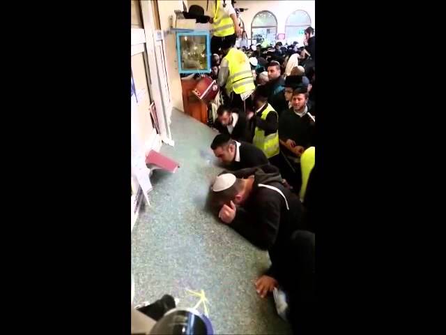 Kissing The Grave Of Rebbe Nachman In Uman