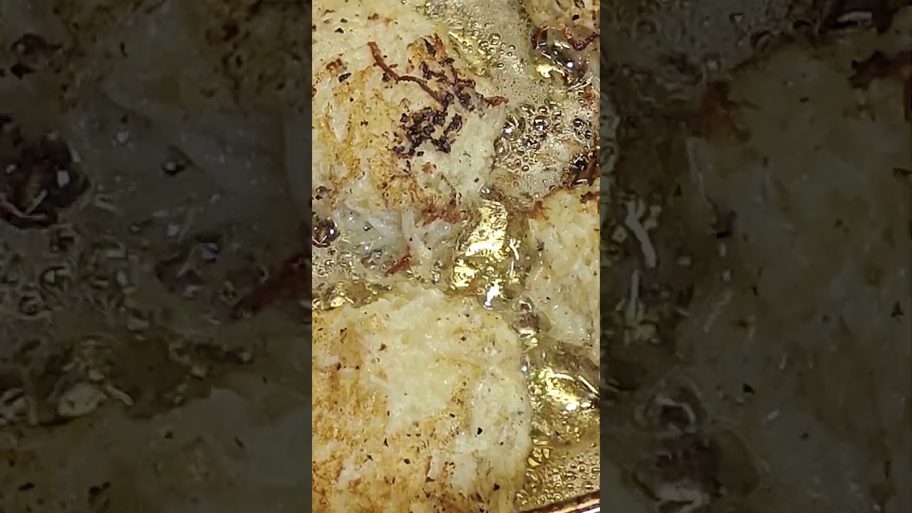 Potato latkes frying in the pan. A special treat for Chanukah!