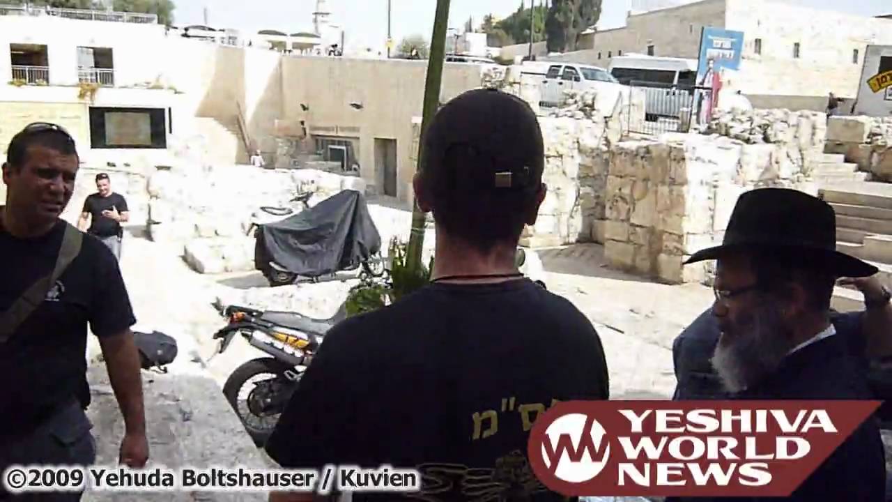 Police Officer Shakes Lulav and Esrog by the Kosel on Hoshana Rabah 5770